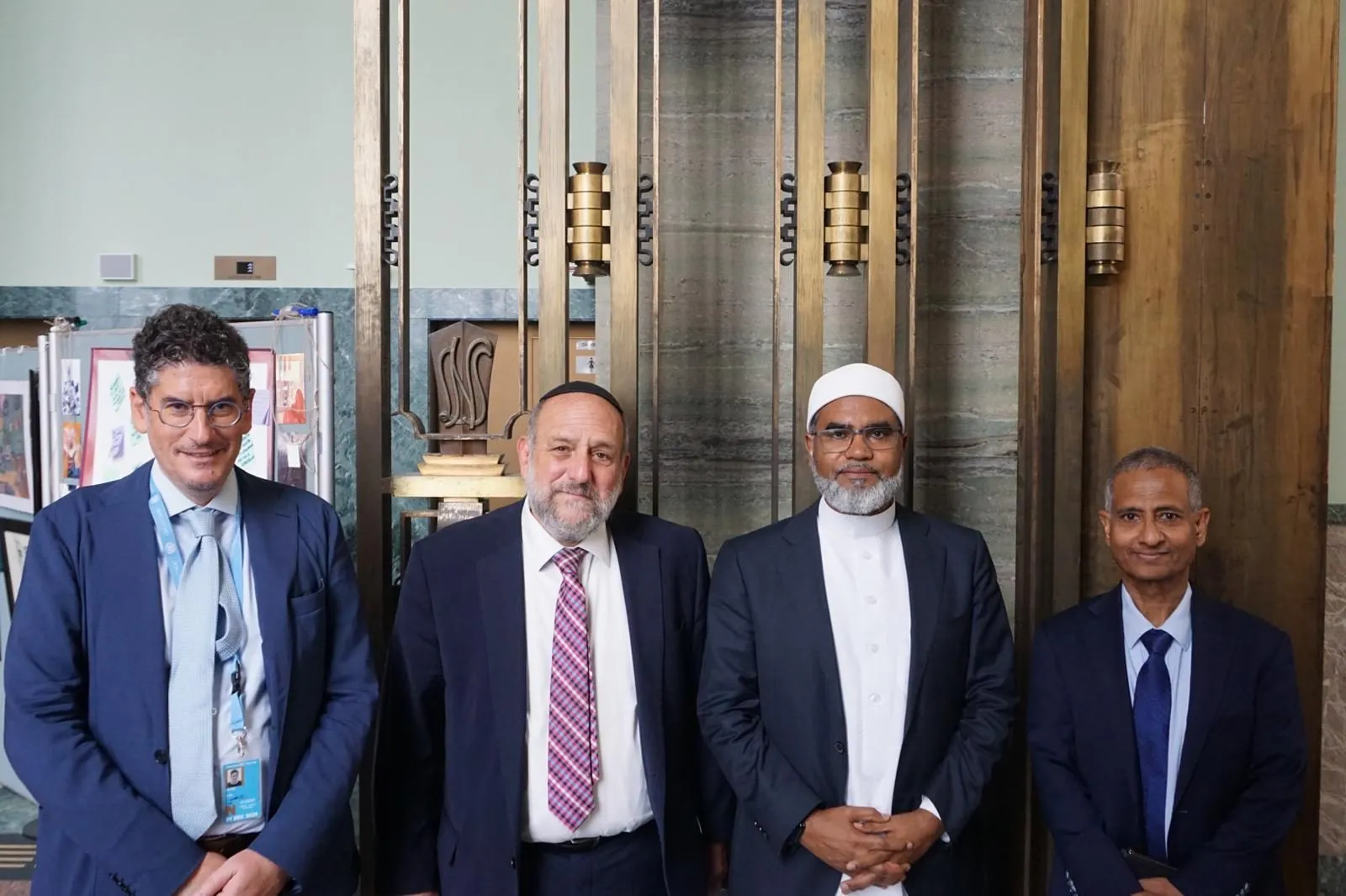 Chief Rabbi Michael Schudrich and Mufti Prof. Dr Faid Mohammed Said standing together with two other participants of the side event.