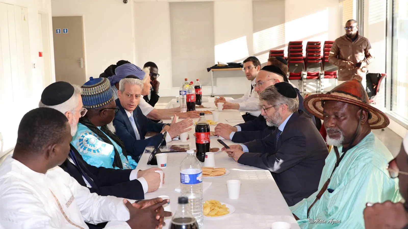 Chief Rabbis, rabbis and members of the Senegalese delegation seated around a long table during the exchange.
