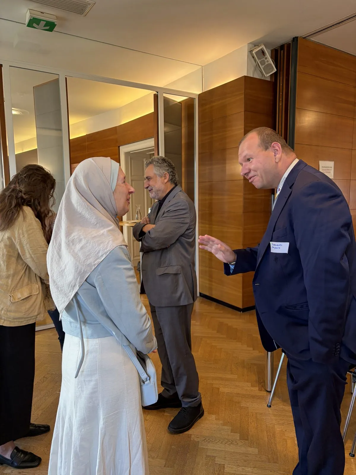 Participants talking during a break of the workshop.